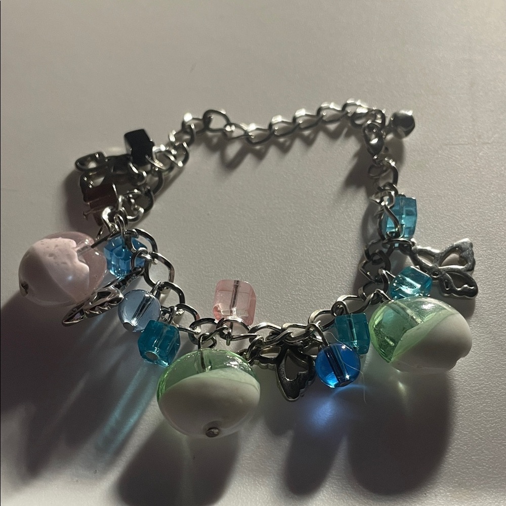 Silver Charm Bracelet with Pastel Beads and Blue Accents